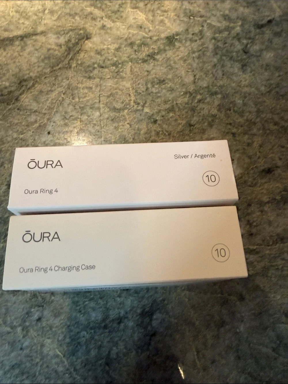 Oura ring 4 size 10 in silver with charging cord PLUS portable charging case.